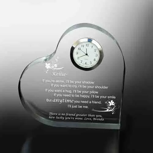 Acrylic heartshaped keepsake gift with a clock and printed message.