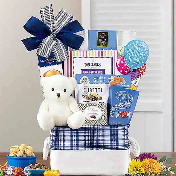 Happy Birthday gift basket includes a cuddly teddy bear and treats