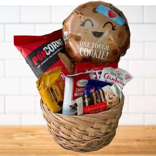 One Tough Cookie gift basket with snacks and One Tough Cookie balloon