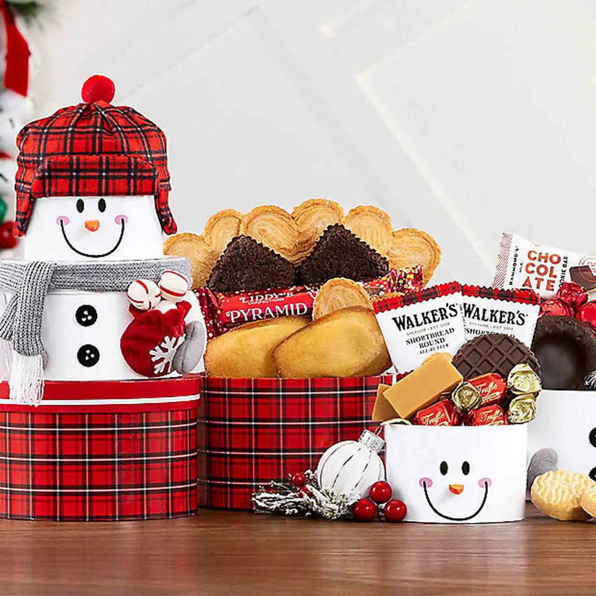 Snowman tower filled with holiday treats