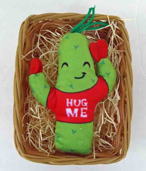 Wicker basket with plush cactus that says Huge Me