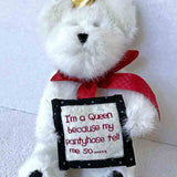 cuddly white teddy bear with crown and sign 